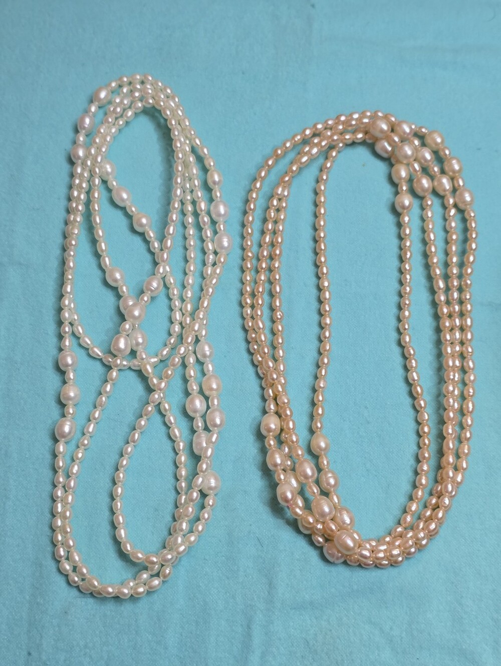TWO PAIRS OF WAIST LENGTH 64 IN GENUINE FRESHWATER BAROQUE PEARL NECKLACES